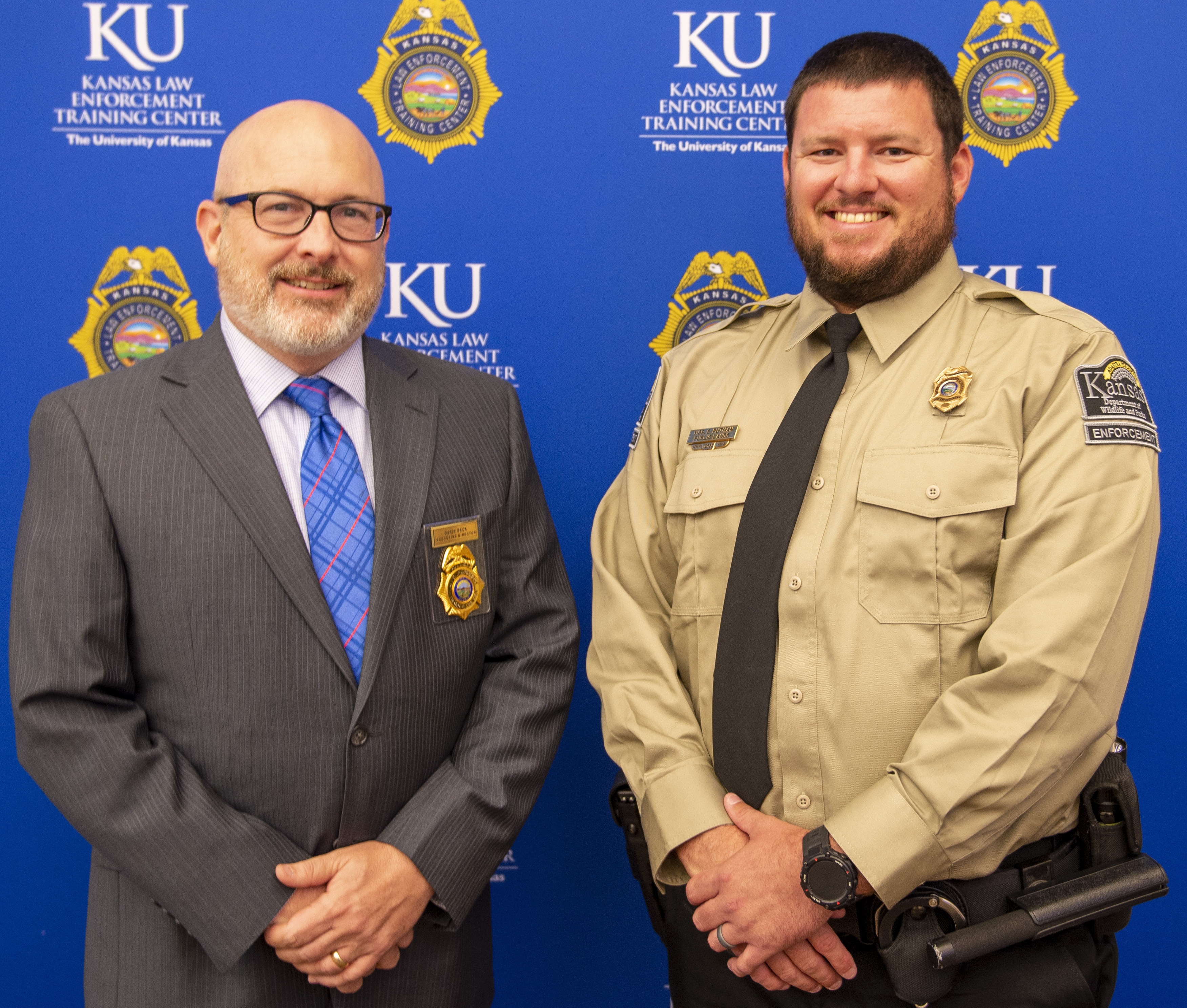 "KLETC Executive Director Darin Beck stands with the class president of the 296th basic training class, Officer Spencer Putman"