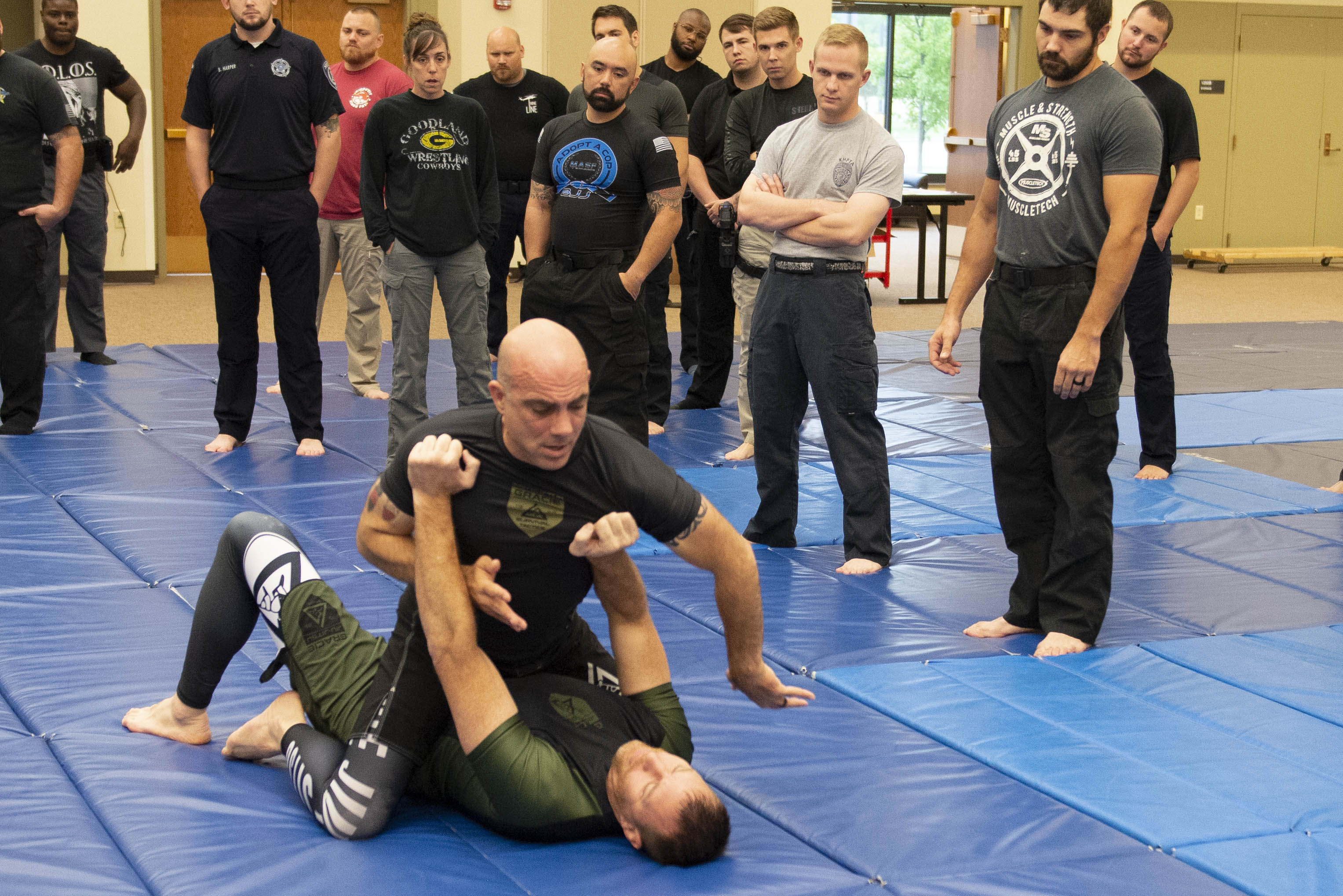 "Gracie University instructors Thomas Chuckerel (top) and Jeremiah Hackerott (bottom) demonstrate tactics for students."