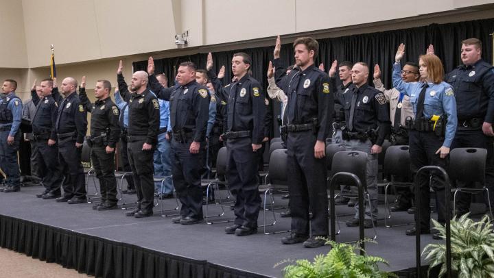 The 28th basic training class recites the oath of office.