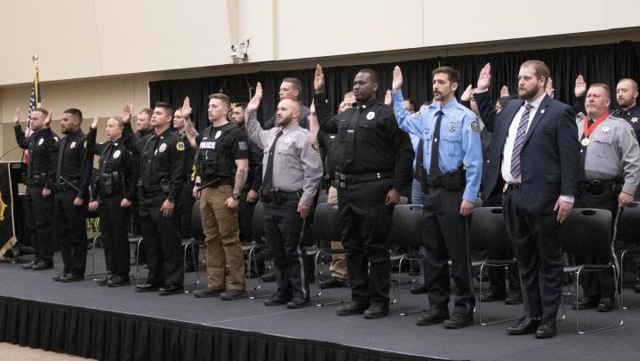 The 290th basic training class recites the oath of office.