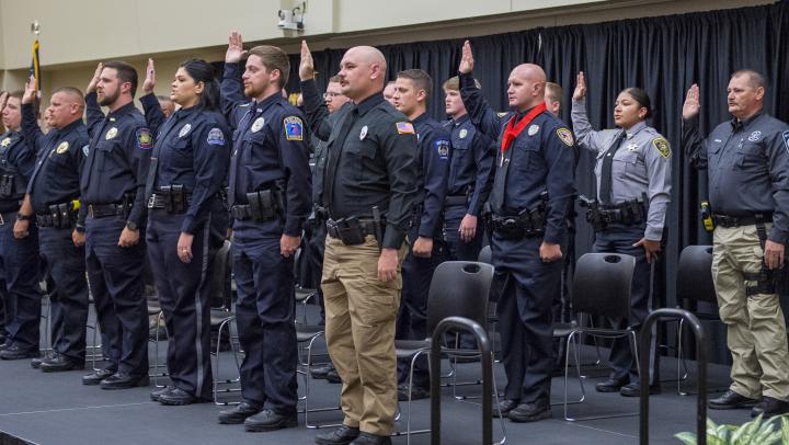 The 297th basic training class recites the oath of office.